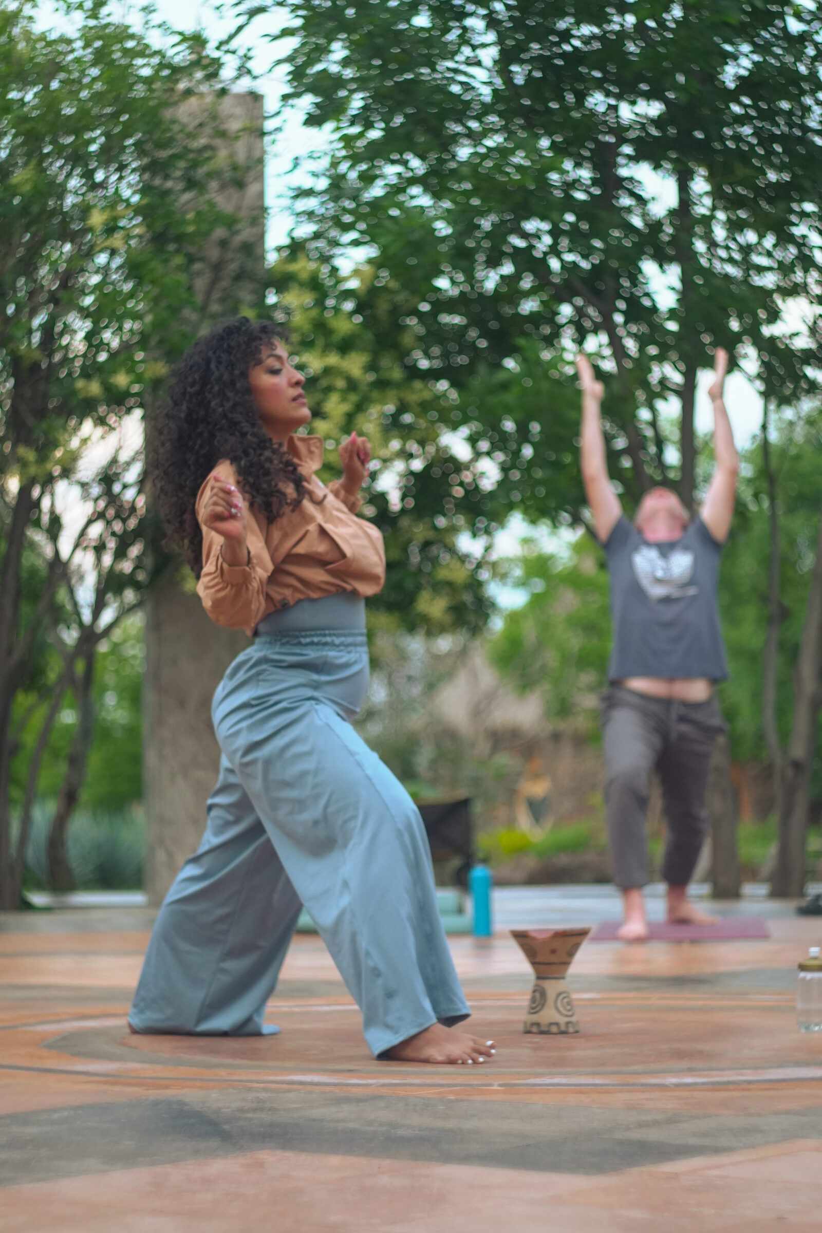 A guest dancing freely on the esplanade