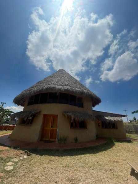 The Hormiguero from outside, a round house with a palm roof