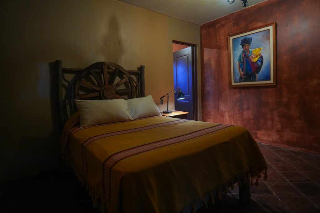 Loba bedroom with a wagon-wheel headboard