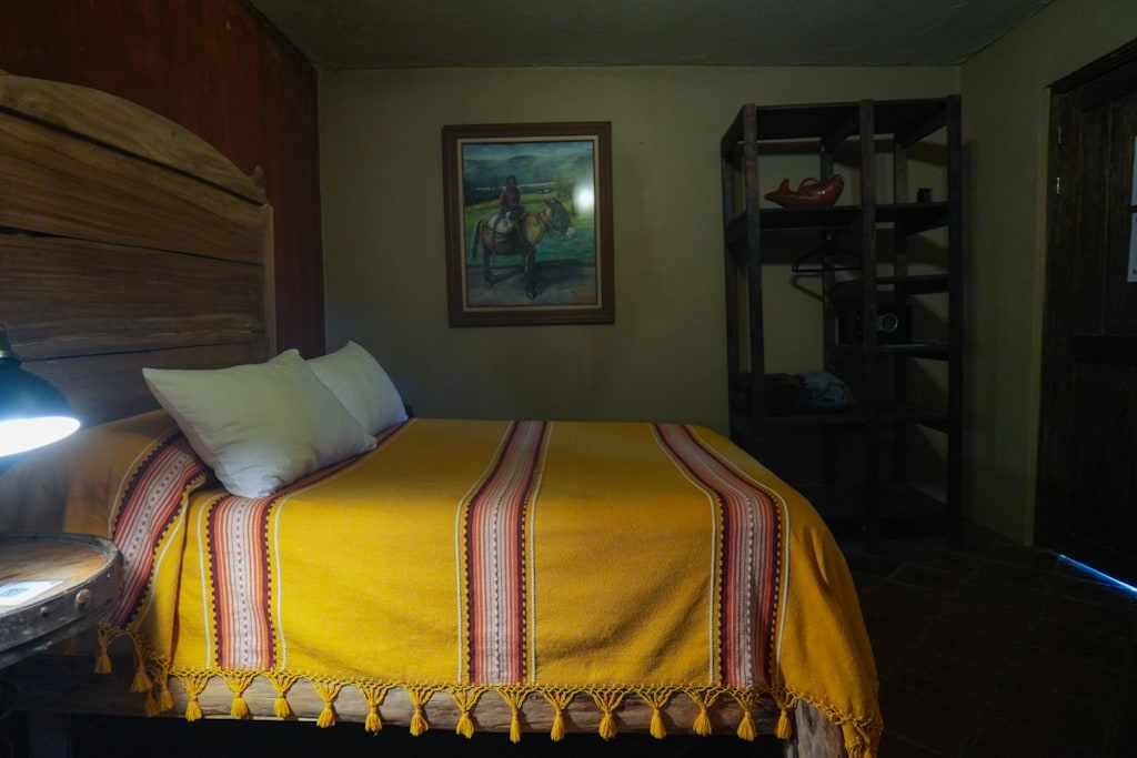 Lobo bedroom with a yellow woven bedspread