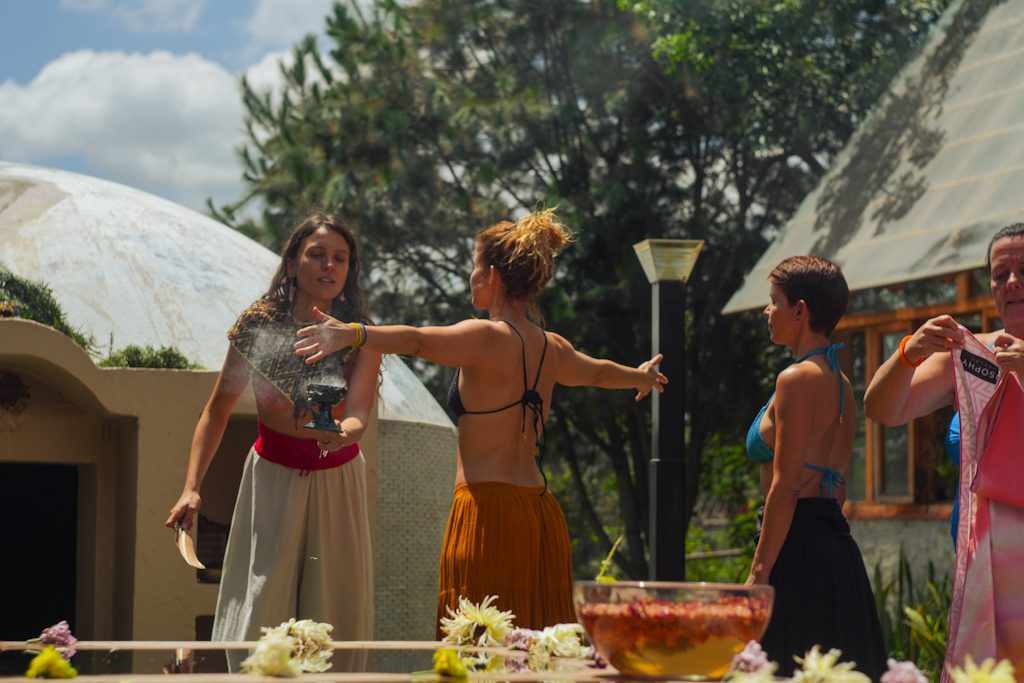 Smudging with copal before ceremony, flowers on the altar